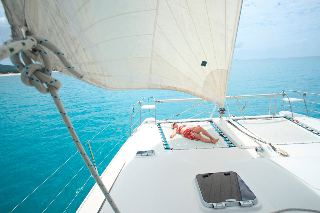 Whitsunday Escape bareboat sailing holioday sunbathing front catamaran islands bareboating in the whitsundays