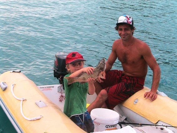 Kids and family fishing in the Whitsundays from a bareboat with Whitsunday Escape